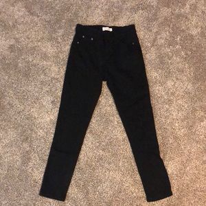 Red Bottom black jeans.